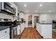 Clean kitchen featuring white subway tile backsplash and stainless steel appliances at 11802 Prairie Pl, Carmel, IN 46033