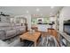 Bright living room with an open floor plan connecting to the dining area and kitchen at 11802 Prairie Pl, Carmel, IN 46033