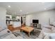 Open concept living room flows into a modern kitchen with stainless steel appliances at 11802 Prairie Pl, Carmel, IN 46033