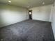 Neutral bedroom features neutral carpet, fresh paint, and closet with door open to a kitchen area at 1218 Bedford Dr, Avon, IN 46123