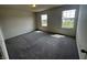 Bright bedroom features neutral carpet, fresh paint, and two windows providing ample natural light at 1218 Bedford Dr, Avon, IN 46123