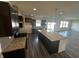 Beautiful open kitchen with a large island, granite countertops, and stainless steel appliances at 1218 Bedford Dr, Avon, IN 46123
