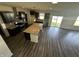 Modern kitchen boasts dark cabinetry, stainless steel appliances, granite counters, and a center island at 1218 Bedford Dr, Avon, IN 46123