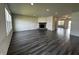 Spacious living room featuring a fireplace, large windows, and hardwood floors at 1218 Bedford Dr, Avon, IN 46123