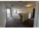 Spacious open loft area features neutral carpet, fresh paint, and a large window for natural light at 1218 Bedford Dr, Avon, IN 46123