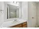 Bathroom featuring a vanity with storage, large mirror, and a view of the shower and toilet area at 12207 Blue Sky Dr, Fishers, IN 46037