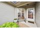 Inviting front porch with a bench, potted plants, and a welcoming front door at 12207 Blue Sky Dr, Fishers, IN 46037