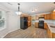 Well-equipped kitchen with stainless steel appliances, wood cabinets, and modern countertops at 12207 Blue Sky Dr, Fishers, IN 46037