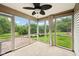 Relaxing screened porch with a ceiling fan, views of the backyard, and access to an outdoor patio at 12207 Blue Sky Dr, Fishers, IN 46037
