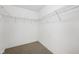 Walk-in closet featuring basic wire shelving and neutral carpet, providing ample storage space at 12207 Blue Sky Dr, Fishers, IN 46037