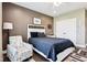 Inviting bedroom showcasing a cozy bed, accent chair, and closet for a comfortable and organized space at 1295 Maclaren Ct, Franklin, IN 46131