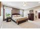 Primary bedroom featuring neutral carpet and paint, natural light, and ensuite access at 1295 Maclaren Ct, Franklin, IN 46131