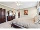 Spacious primary bedroom with a closet, dresser, ensuite bathroom with neutral-colored walls and carpet at 1295 Maclaren Ct, Franklin, IN 46131