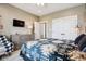 Relaxing primary bedroom with a ceiling fan, a dresser, and a TV at 1295 Maclaren Ct, Franklin, IN 46131