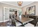 Elegant dining room boasts modern light fixture, neutral colors, and access to living area at 1295 Maclaren Ct, Franklin, IN 46131