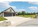 Spacious three-car garage, expansive concrete driveway, and professionally landscaped yard at 1295 Maclaren Ct, Franklin, IN 46131
