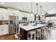 Modern kitchen with island seating, stainless appliances, and ample counter space at 1295 Maclaren Ct, Franklin, IN 46131
