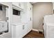 Efficient laundry room with sleek cabinets, modern appliances, and space-saving design for easy chores at 1295 Maclaren Ct, Franklin, IN 46131
