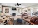 Spacious living room with a fireplace, built-in shelves, hardwood floors, and comfortable seating arrangement at 1295 Maclaren Ct, Franklin, IN 46131