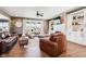 Cozy living room features hardwood floors, fireplace, and comfortable leather seating at 1295 Maclaren Ct, Franklin, IN 46131
