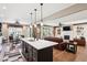 Open-concept living area features fireplace, hardwood floors, and breakfast area with exterior views at 1295 Maclaren Ct, Franklin, IN 46131