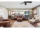 Open concept living and kitchen area with stainless appliances and leather furnishings at 1295 Maclaren Ct, Franklin, IN 46131