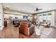 Open-concept living area with hardwood floors, comfortable leather seating, and modern decor at 1295 Maclaren Ct, Franklin, IN 46131