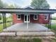 A covered patio provides shade and an outdoor living space, perfect for relaxing or entertaining guests at 1445 S 750 W, Shelbyville, IN 46176