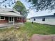 The backyard includes a covered patio attached to the main house and a detached garage with additional outdoor space at 1445 S 750 W, Shelbyville, IN 46176