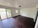 Spacious bedroom with hardwood floors, a sliding glass door to a deck, and natural light at 1445 S 750 W, Shelbyville, IN 46176