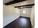 Cozy bedroom featuring hardwood floors, a window, and ample natural light at 1445 S 750 W, Shelbyville, IN 46176