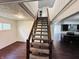 Carpeted staircase with wood handrail leading to the upper level at 1445 S 750 W, Shelbyville, IN 46176