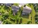 Backyard featuring a sprawling lawn, deck, mature trees, and meticulous landscaping at 15047 Glenmoor Cir, Carmel, IN 46033