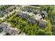 An aerial view shows the property in a neighborhood with mature trees and landscaping at 15047 Glenmoor Cir, Carmel, IN 46033