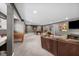 Spacious finished basement with lounge area, pool table, foosball table, and mounted television at 15047 Glenmoor Cir, Carmel, IN 46033