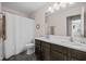 This modern bathroom has a double sink vanity and a shower tub combination with tile floors at 15047 Glenmoor Cir, Carmel, IN 46033