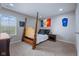 This bedroom features a four-poster bed frame, carpeting, and natural light at 15047 Glenmoor Cir, Carmel, IN 46033