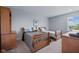 This bedroom features two twin beds, carpeting, and wooden furniture at 15047 Glenmoor Cir, Carmel, IN 46033