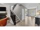 Welcoming entryway featuring a staircase, hardwood floors, and bright natural light at 15047 Glenmoor Cir, Carmel, IN 46033