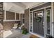 Inviting front door with stylish wreath, comfortable seating, and a welcoming atmosphere at 15047 Glenmoor Cir, Carmel, IN 46033