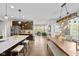 Open-concept kitchen and dining area with a large island and stainless steel appliances at 15047 Glenmoor Cir, Carmel, IN 46033