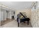 Bright music room features a grand piano and leads into an open-concept living space at 15047 Glenmoor Cir, Carmel, IN 46033