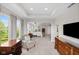 Spacious main bedroom featuring sitting area and abundant natural light, designed for comfort and relaxation at 15047 Glenmoor Cir, Carmel, IN 46033