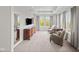 Bright main bedroom with sitting area, dresser, and lots of natural light, creating a relaxing retreat at 15047 Glenmoor Cir, Carmel, IN 46033