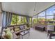 Cozy screened porch with comfortable seating, creating a relaxing outdoor living space at 15047 Glenmoor Cir, Carmel, IN 46033