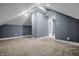 An attic featuring neutral walls and carpet flooring, offering a versatile space at 1529 E Tabor St, Indianapolis, IN 46203
