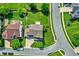 Aerial view of a home with a large, well-maintained backyard, surrounded by mature trees and neighborhood streets at 16138 Palmyra Green, Westfield, IN 46074