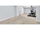 Spacious finished basement featuring workout equipment and neutral carpet at 16138 Palmyra Green, Westfield, IN 46074