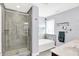 Bright bathroom with a tiled walk-in shower, a soaking tub, and double sinks at 16138 Palmyra Green, Westfield, IN 46074