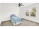 Bright bedroom with a window view, featuring a calming blue quilted bedspread at 16138 Palmyra Green, Westfield, IN 46074